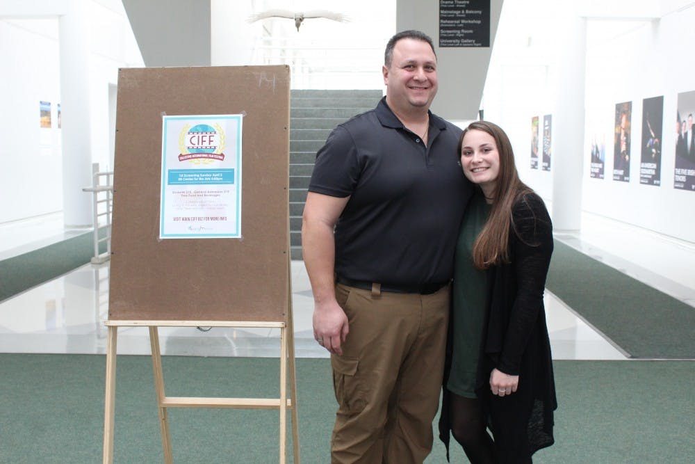 <p>Courtney Chiappone stands with her father Jack Chiappone, a police and fire dispatcher in the Town of Hamburg. Chiappone’s film “Suspicion” was one of the top entries in Sunday’s film festival.&nbsp;</p>