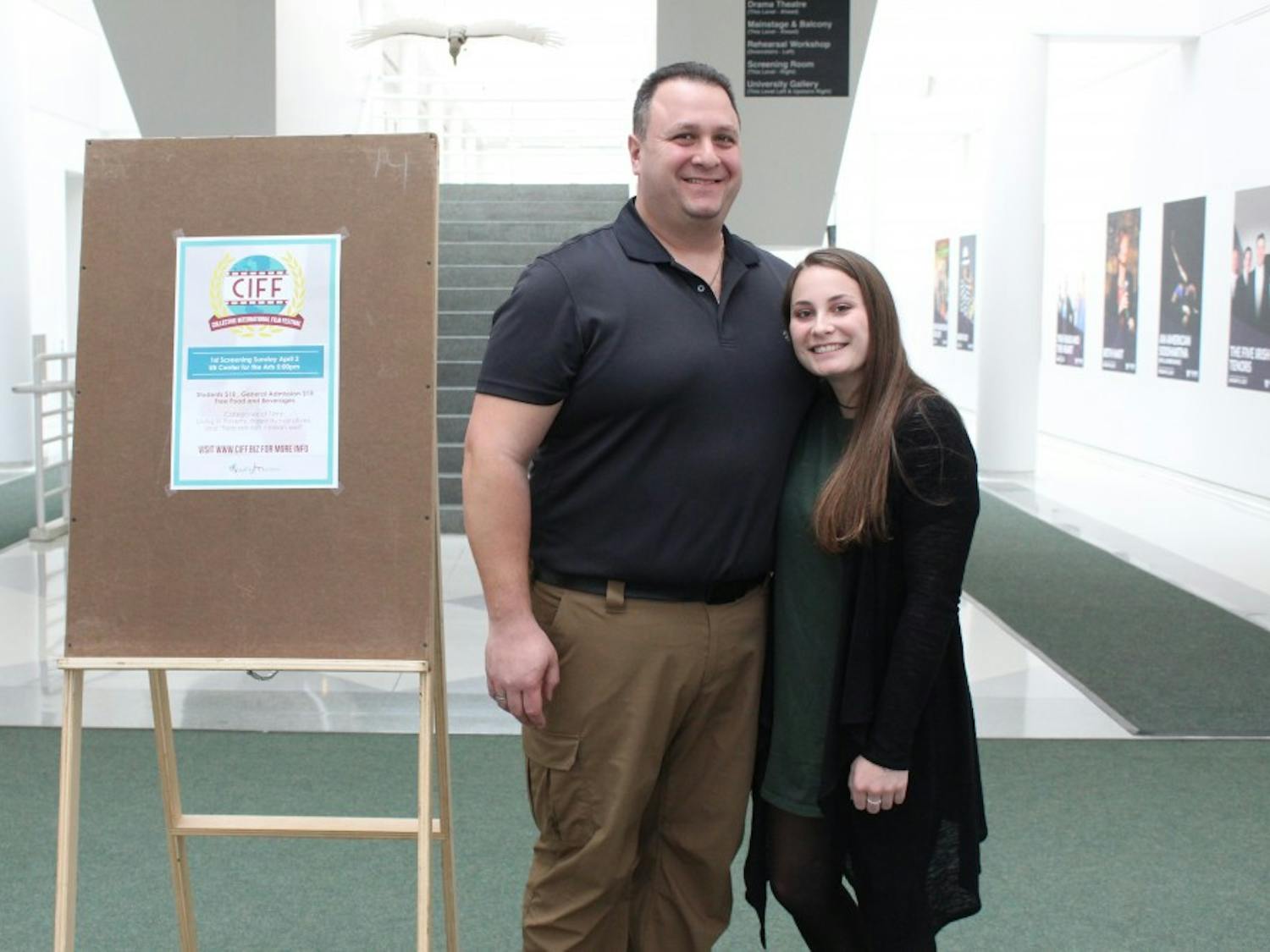 Courtney Chiappone stands with her father Jack Chiappone, a police and fire dispatcher in the Town of Hamburg. Chiappone’s film “Suspicion” was one of the top entries in Sunday’s film festival.&nbsp;