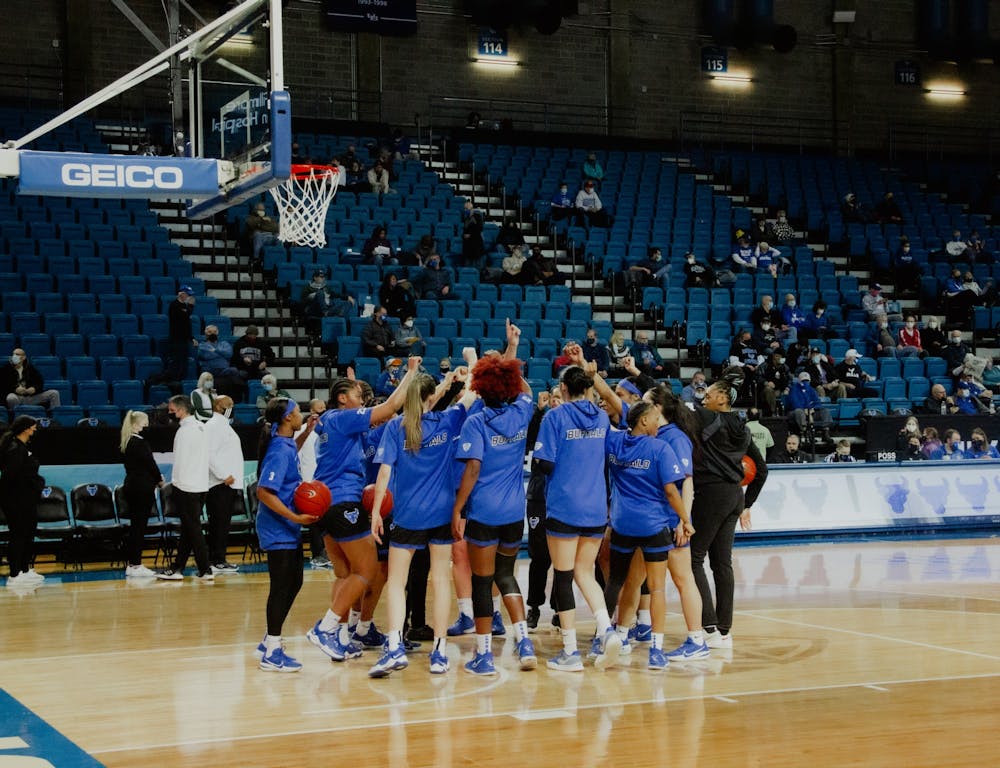 The women's basketball team huddles up before a recent game against Ohio University.