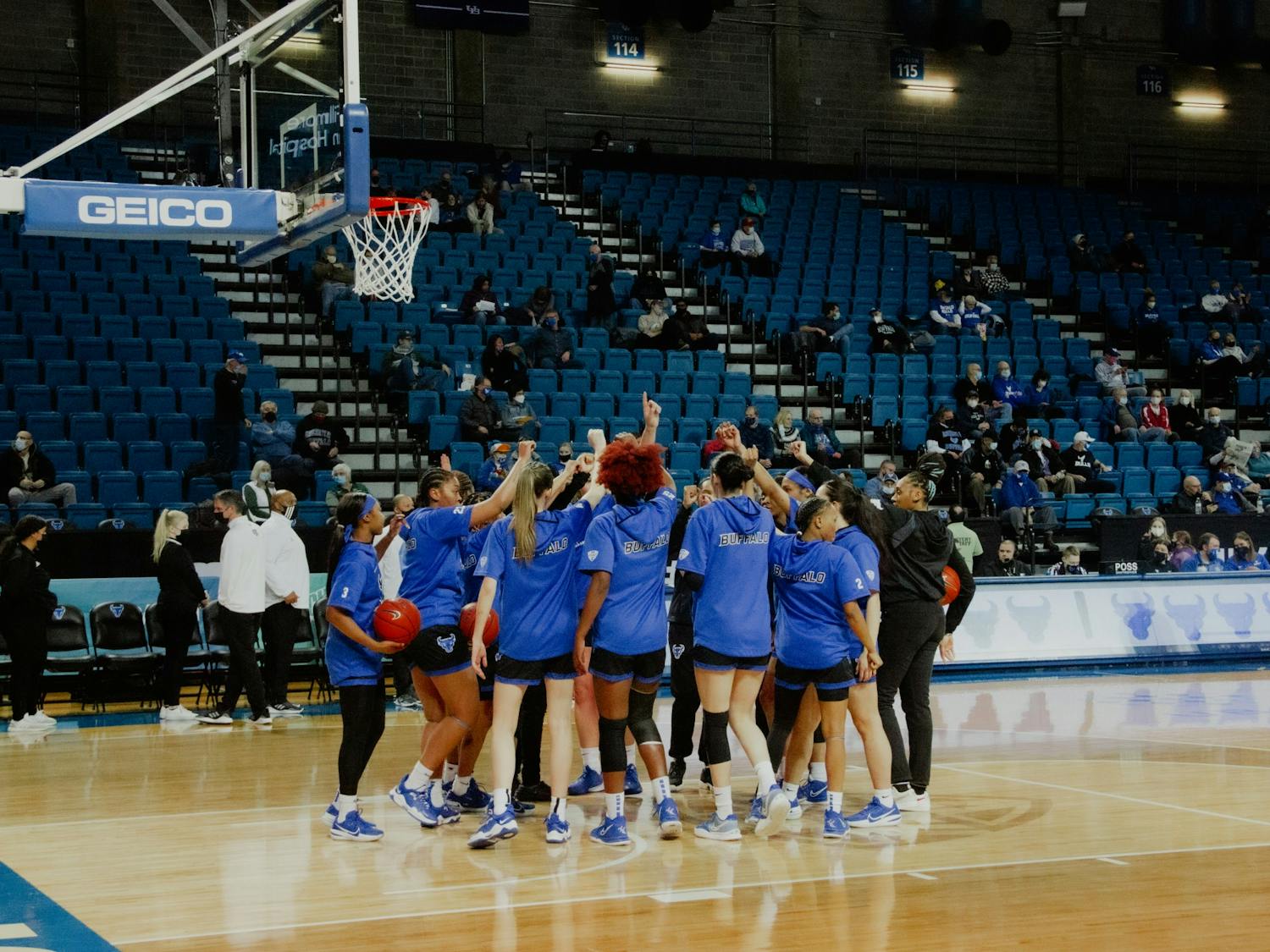 The women's basketball team huddles up before a recent game against Ohio University.