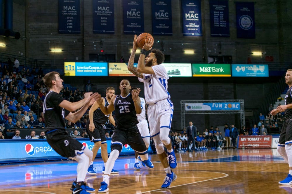 <p>Senior forward Jeremy Harris attempts a floater against Daemen. Harris has struggled in his past three games making 8-32 shots.</p>