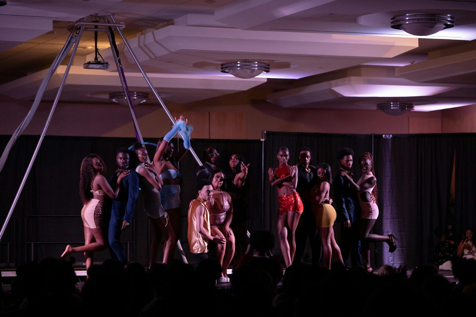 Models pose on stage at Black Explosion. 