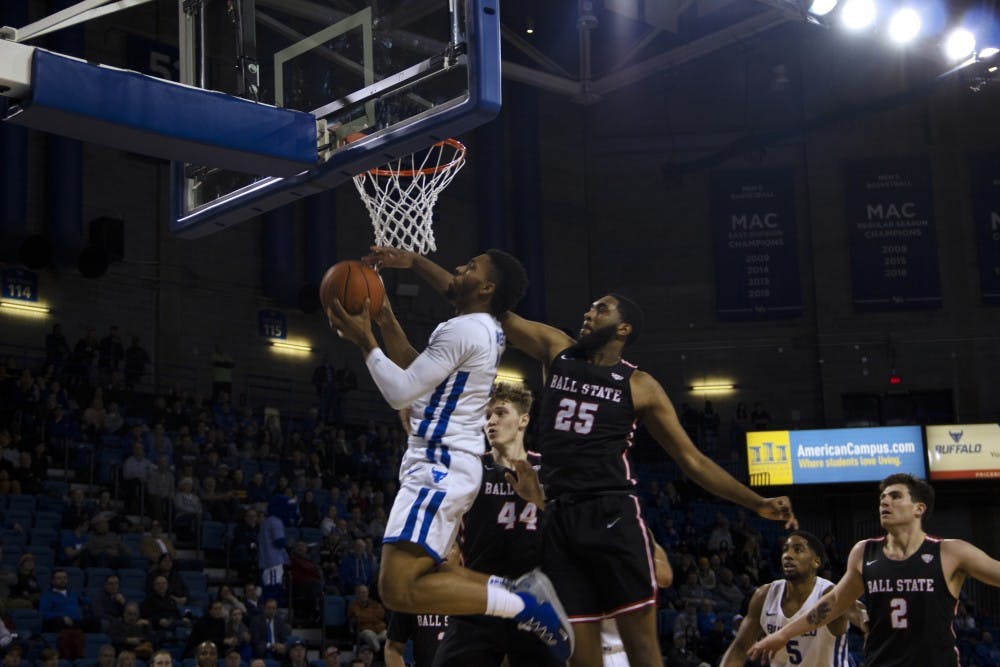 <p>Sophomore guard Jayvon Graves goes up and under the rim for a layup. Graves finished with a double double in the 83-59 win.&nbsp;</p>