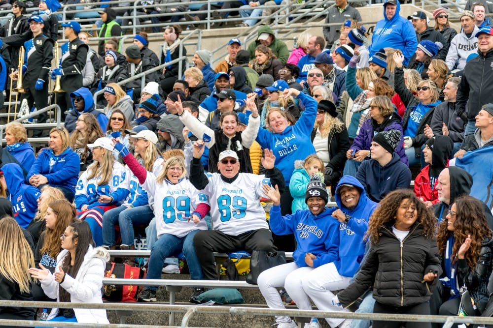 <p>Students and community members celebrate at a UB Football game this season. UB has applied for a license to serve alcohol at its sports games, which members of athletics have described as “family-friendly.”</p>