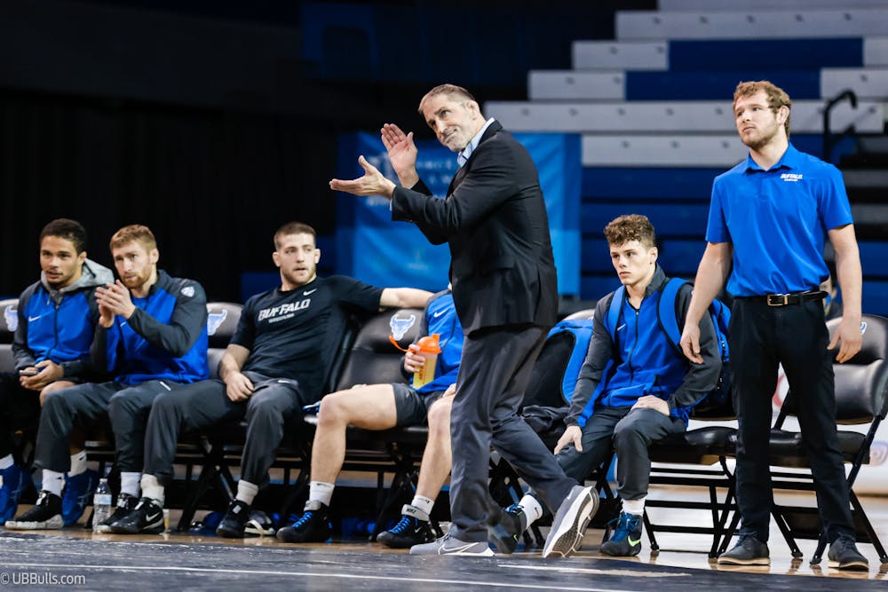 <p>John Stutzman, pictured above, was suddenly removed as wrestling head coach on Thursday after 11 seasons with the Bulls.&nbsp;</p>