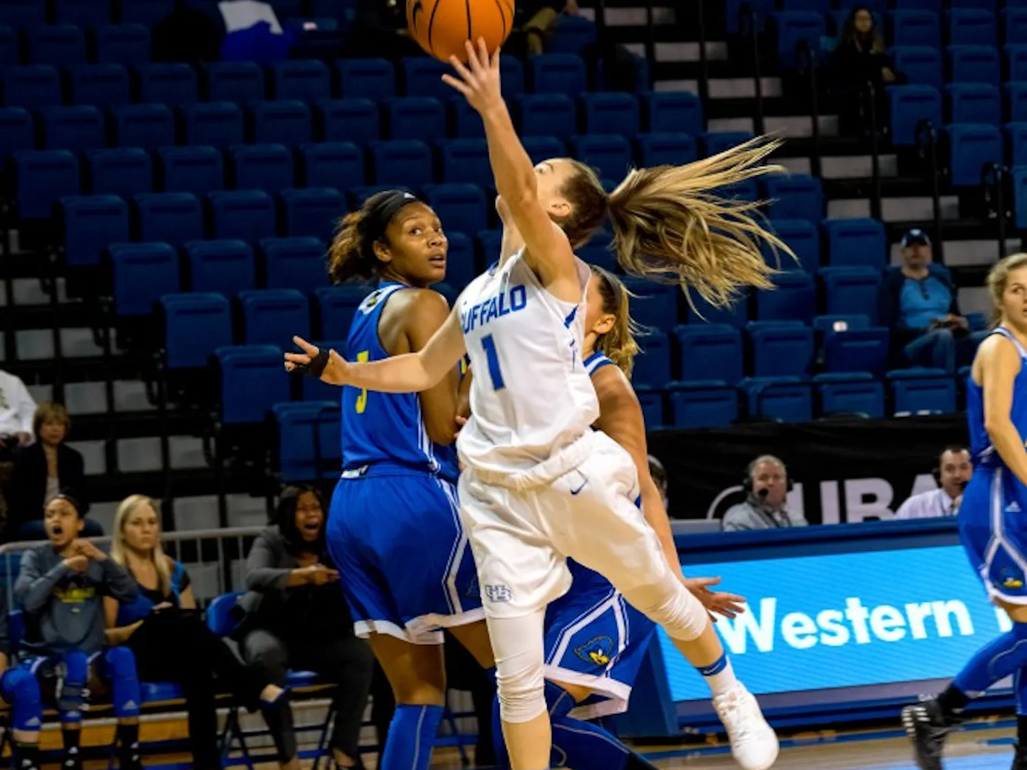 Senior guard Stephanie Reid comes in for the layup. Reid is coming off a strong performance in the Bulls' win on Saturday.