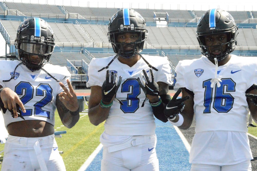 Running back Al-Jay Henderson (22), wide receiver Quian Williams (3) and wide receiver Ali Fisher pose for a photo during the UB Spring Football Game.