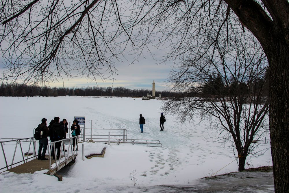 <p>Students walk on a frozen Lake LaSalle during the 2022 spring semester.&nbsp;</p>