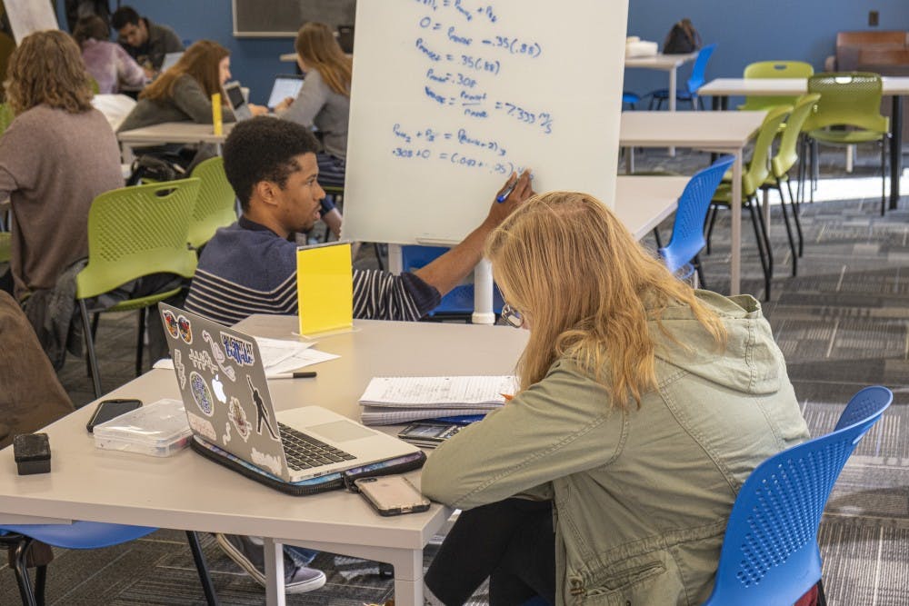 <p>Students working in UB's new Tutoring and Academic Support Services center in Capen.</p>