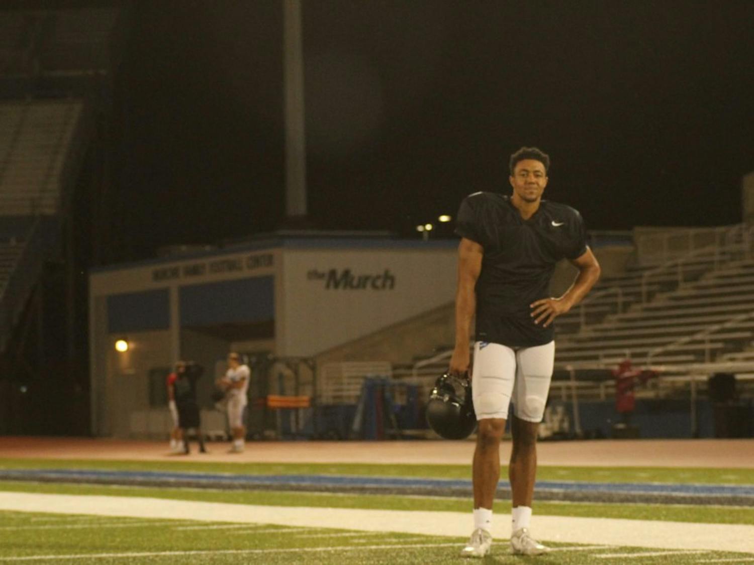 UB football player Dominic Johnson stands on UB Stadium.