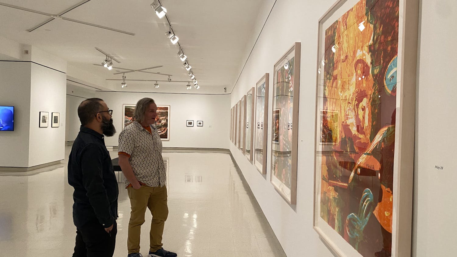 Artists Zorawar Sidhu and Rob Swainston stand in front their work at the “History is Present" exhibition. The exhibit will be on view at UB’s Anderson Gallery until July 26.&nbsp;