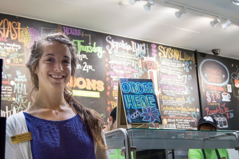 <p>Hannah Perno, a senior environmental science major, was commissioned to create the vibrant blackboard menu in the new Center for the Arts café, Seasons. The organic café and juice bar is part of UB Campus Dining and Shops and UB Sustainability’s initial plan for a greener campus.</p>