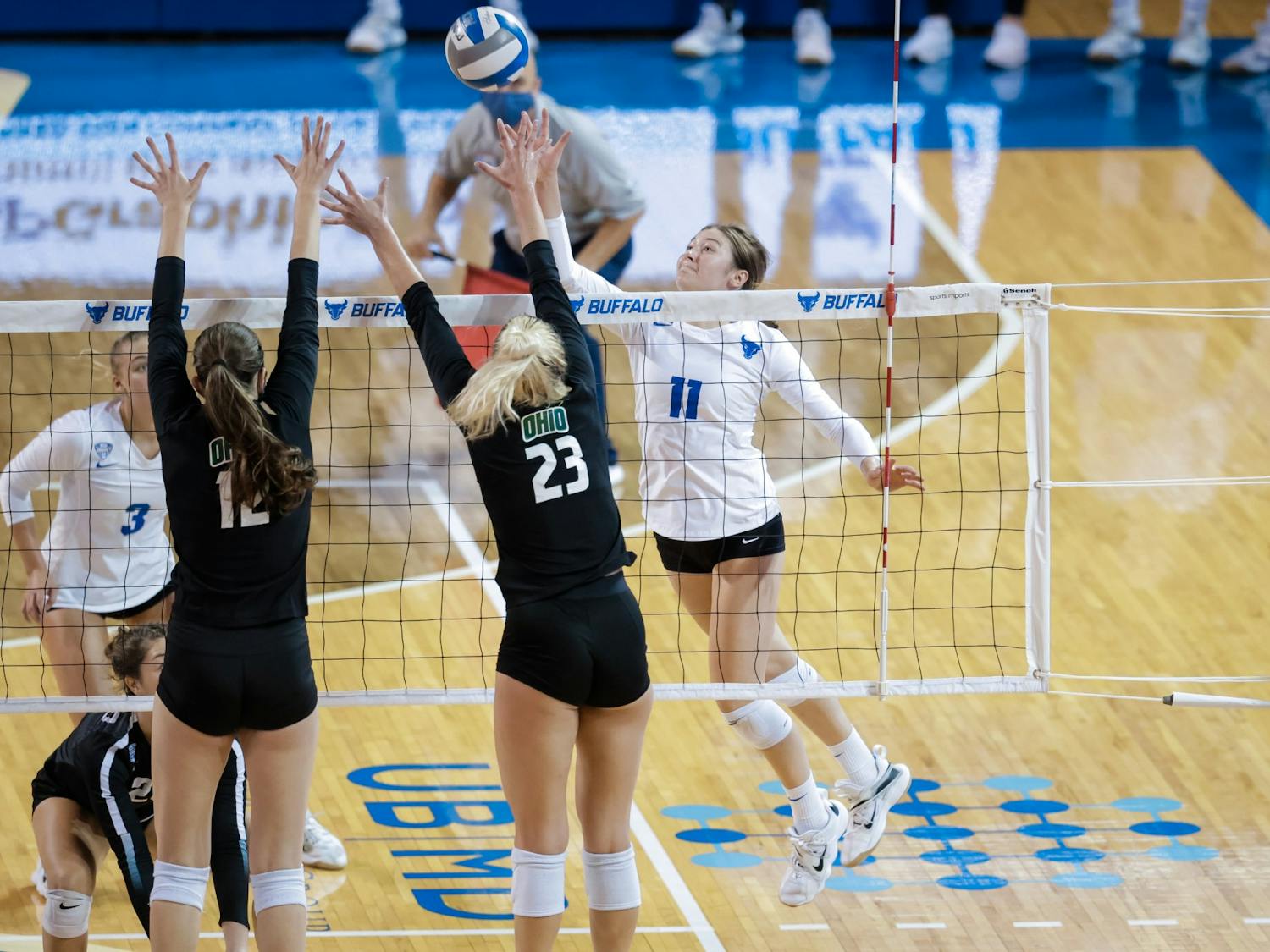 Freshman outside hitter Maria Futey (11) goes for a spike during a recent game against Ohio.