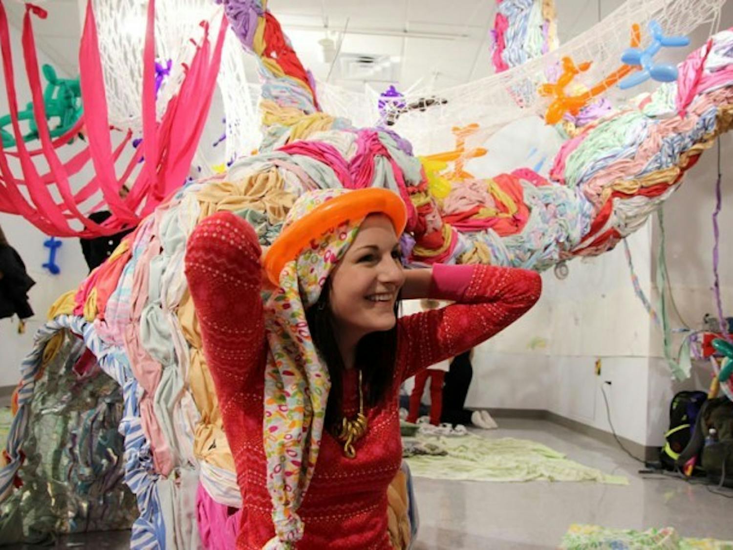 Amber Sliter hopes the installation will help break the boundaries set by conventional art exhibits. Sliter and Sato’s no shoe policy is part of their attempt to create an atmosphere where people play and interact with the exhibit they’ve produced. Jordan Oscar, The Spectrum