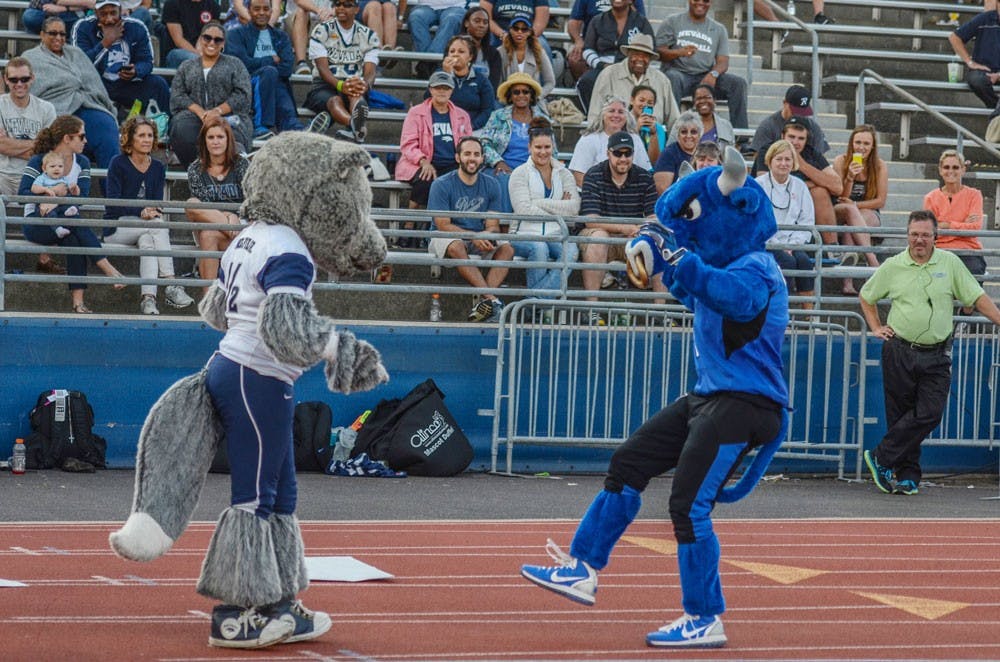 <p>Victor E. Bull has a dance-off with an opposing mascot. The current student who wears the mascot suit says he has incorporated dancing as a bigger part of the character.</p>