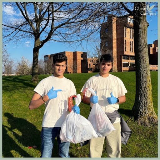 Chirag Ohiri (left) and Aryan Mudgal (right) doing a campus cleanup near the Ellicott Complex.