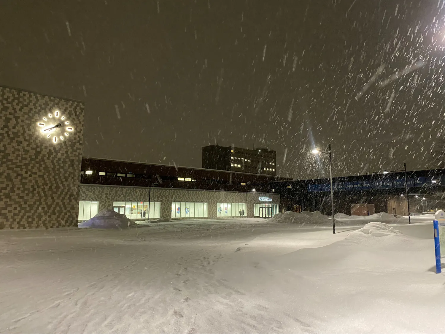 Snow falling in front of UB's Norton Hall.