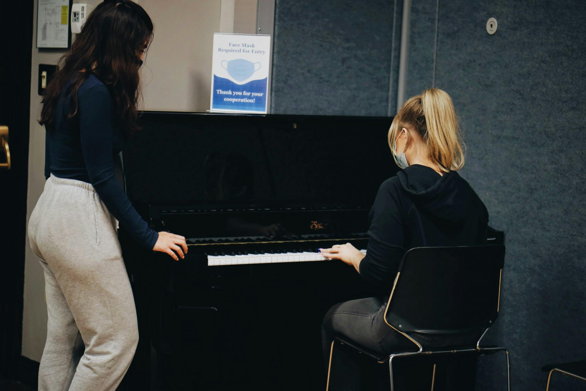 Junior occupational therapy majors Ciana and Hannah play the piano located in 145a Student Union