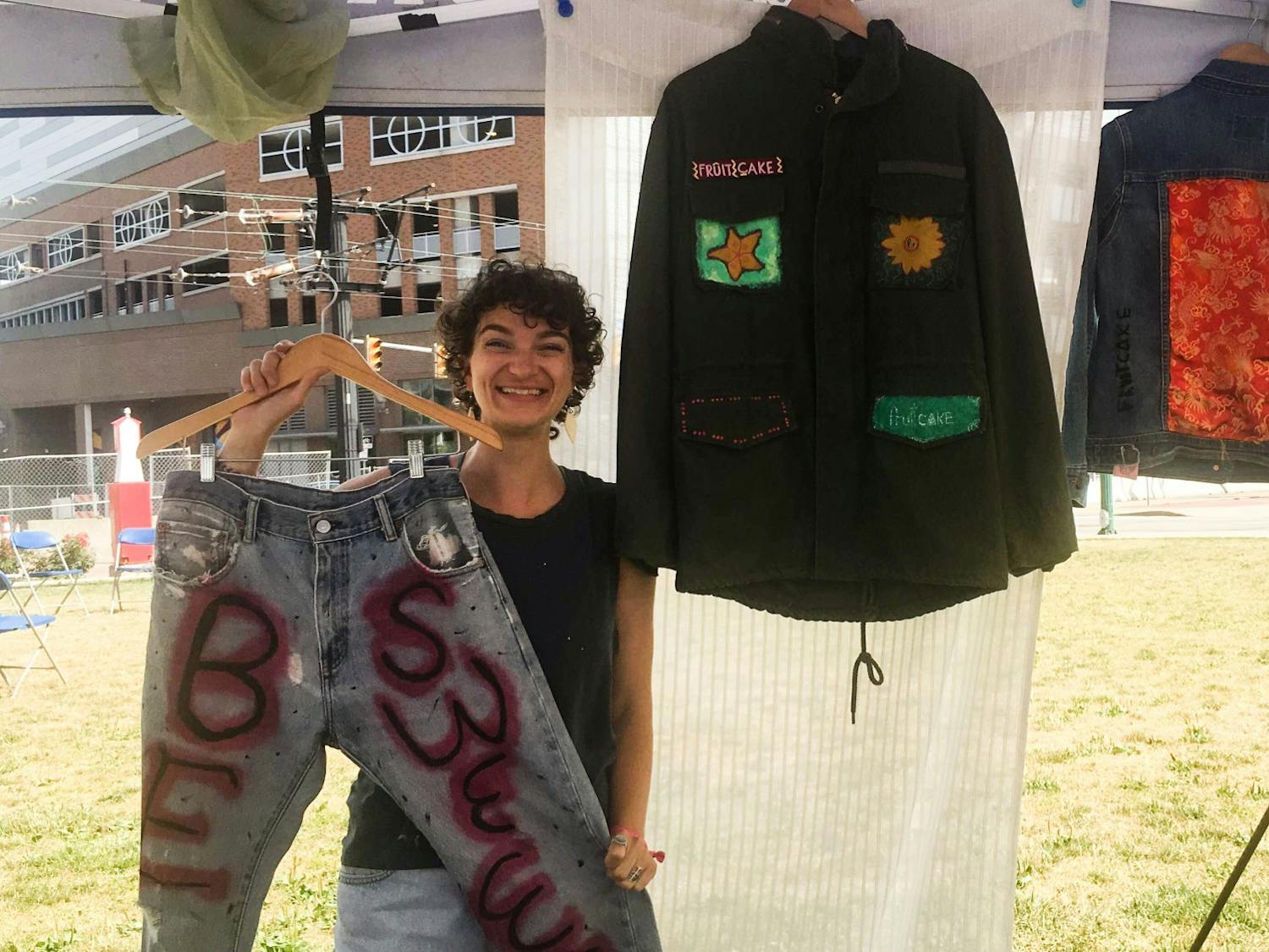 Julia Erbacher selling upcycled pieces at a local art festival.