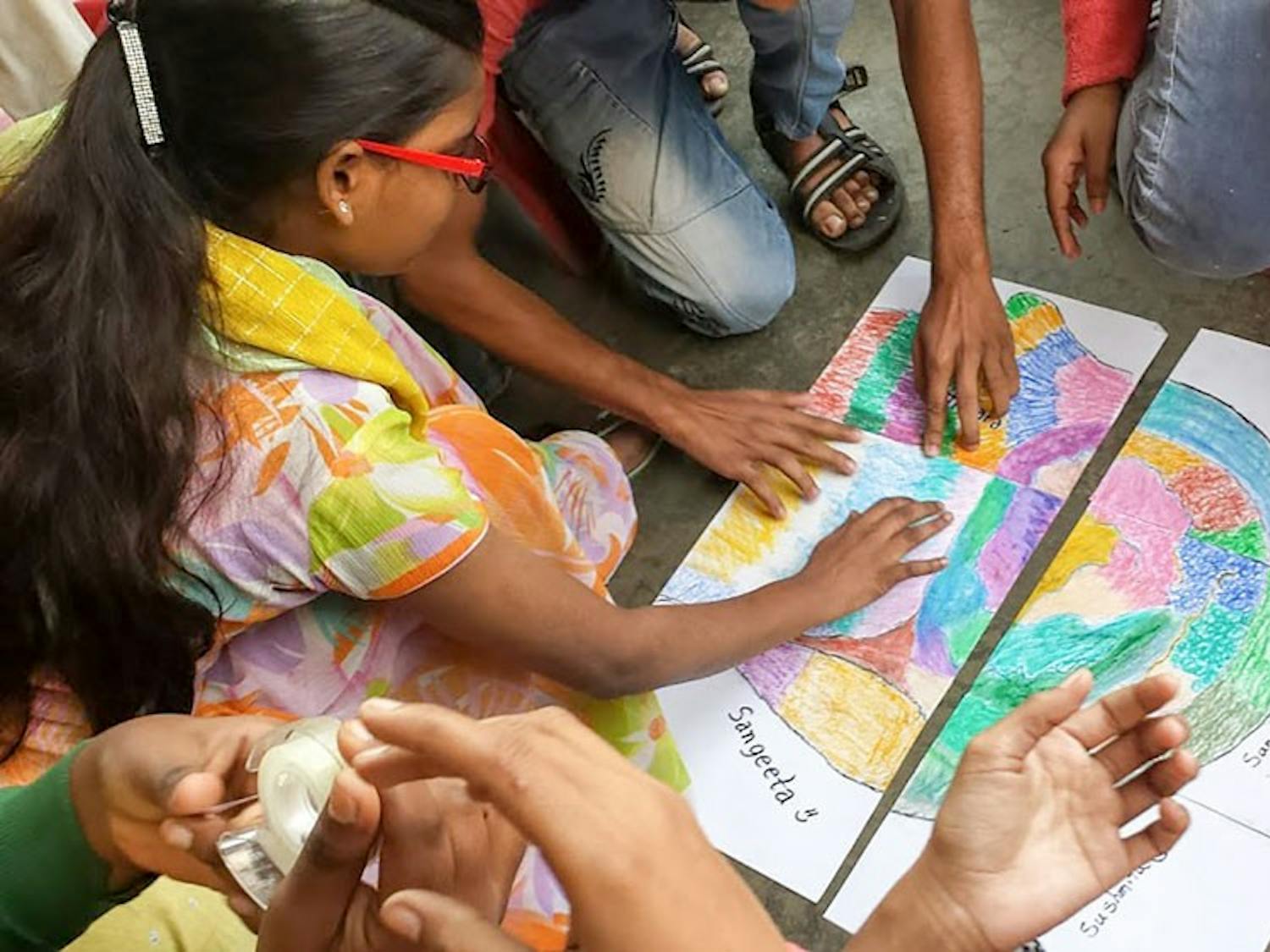 Students at Calcutta Rescue work together on a project for Beyond the Block. Calcutta Rescue is a non-government organization specialized in helping and educating children from nearby slums.