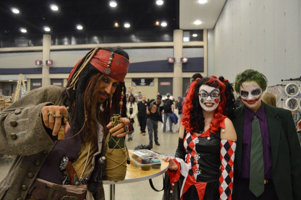 <p>A group of cosplayers consisting of a Joker, a Harley Quinn and a Captain Jack Sparrow enjoys Buffalo Comic Con, which moved this year to the Buffalo Convention Center as part of a two-day event Oct. 17-18. The event was hugely popular, with multiple different events held each day including meet-and-greets with different comic artists, cosplay contests and more.</p>