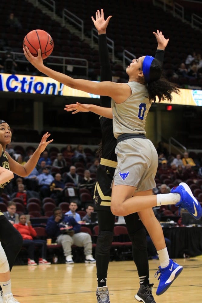 Junior forward Summer Hemphill converts the tough layup. The Bulls, without Hemphill, lacked their best athlete on the court.