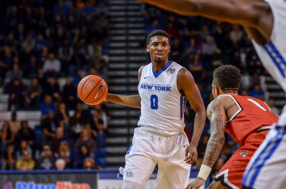 <p>Junior forward Blake Hamilton looks to make a pass into the paint. Hamilton led the Bulls 17 points as the Bulls defeated Toledo 73-68, their second straight Mid-American Conference win.</p>