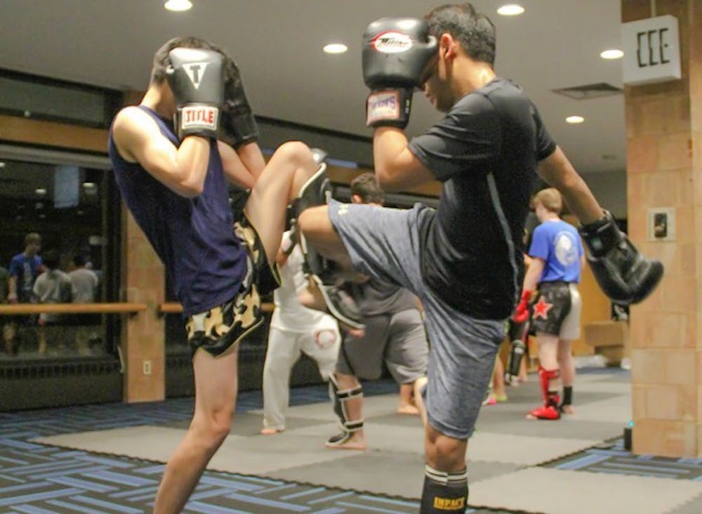 Students participate in Combined Martial Arts Club&rsquo;s Muay Thai class. CMAC teaches five different kinds of martial arts and estimates over 100 students participate in the club.
Andy Koniuch, The Spectrum