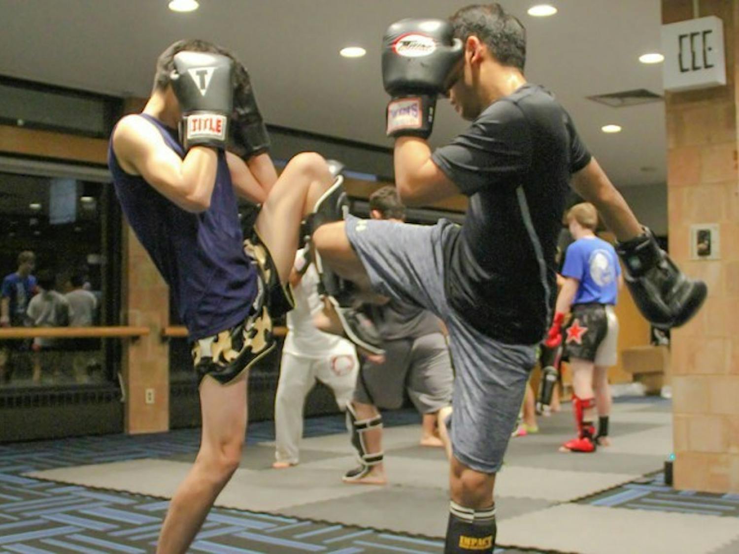 Students participate in Combined Martial Arts Club’s Muay Thai class. CMAC teaches five different kinds of martial arts and estimates over 100 students participate in the club.
Andy Koniuch, The Spectrum