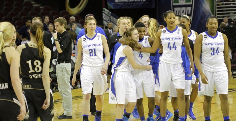 <p>The women's basketball team celebrates its MAC quarterfinals win over Western Michigan in Quicken Loans Arena on March 12. The Bulls face West Virginia Thursday in the team's first ever WNIT appearance. </p>