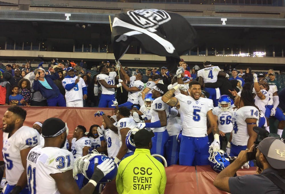 <p>The Bulls celebrate after beating the Temple Owls 36-29 on the road Saturday. This marked the first time in the program's Division-I that they have started a season 2-0.</p>