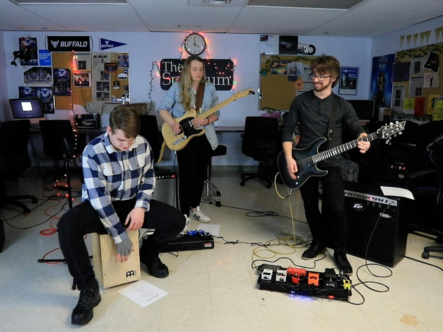 The three-piece rock group, fronted by UB electrical engineering senior Joseph Gogan (left) with guitarists Katie Missert (middle) and Matthew Riley (right), played a raucous set that featured both original songs and a host of classic covers.