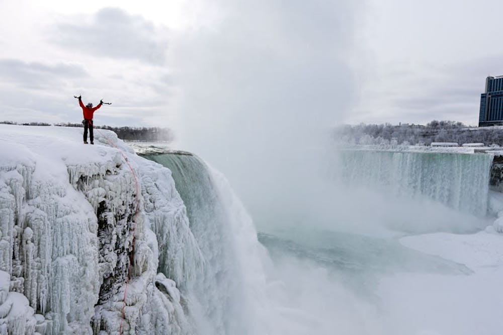 <p>Will Gadd celebrating on top of the frozen section of ice on Horseshoe Falls he climbed on Jan. 27, 2015.</p>