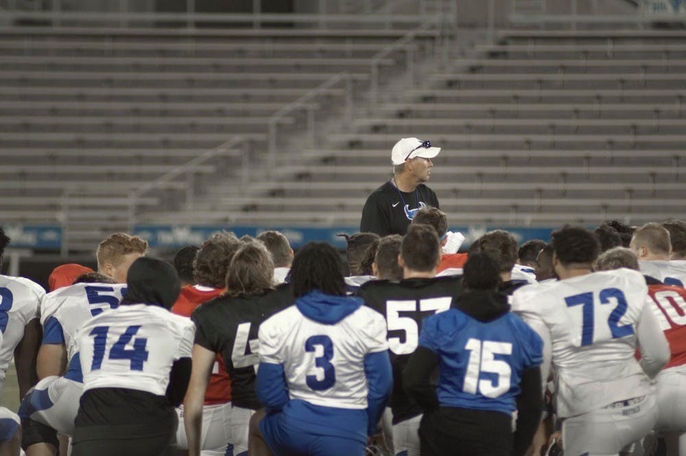 <p>Head football coach Lance Leipold talks strategy with the UB football team.&nbsp;</p>