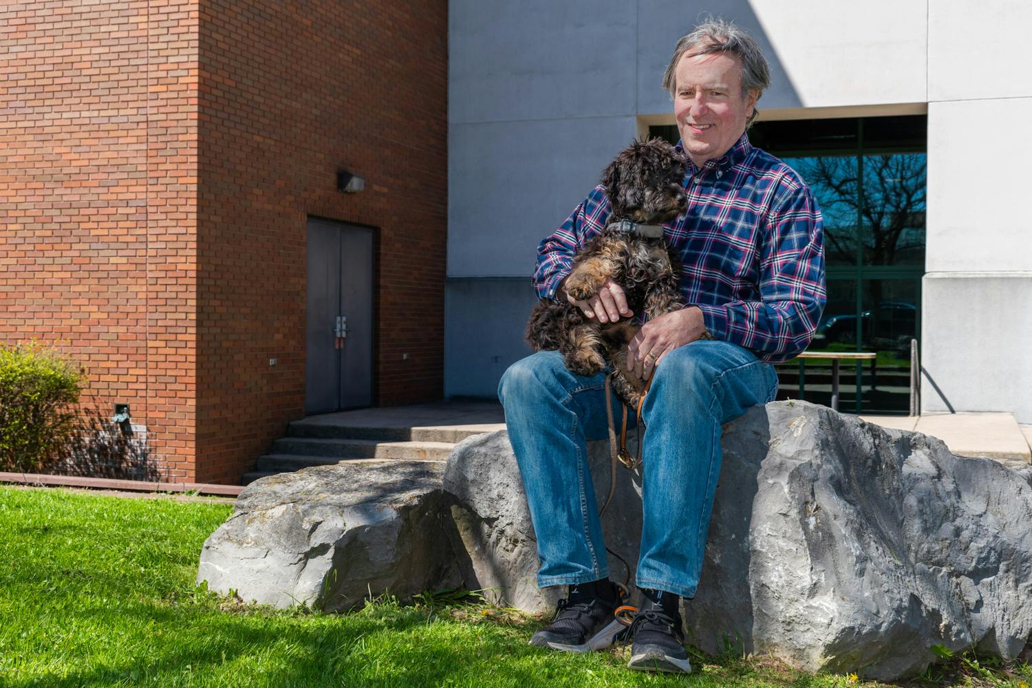 Dan Ryan, director of Veteran Services, and his new puppy, Finn, are inseparable.