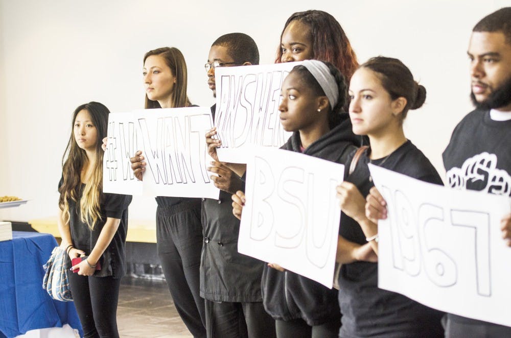 <p>Black Student Union members&nbsp;protest President Satish Tripathi’s State of the University Address in October, demanding a university policy on art in public spaces. UB announced an interim policy on Thursday, which states that student artwork outside the Center for the Arts must be&nbsp;labeled as such.&nbsp;</p>