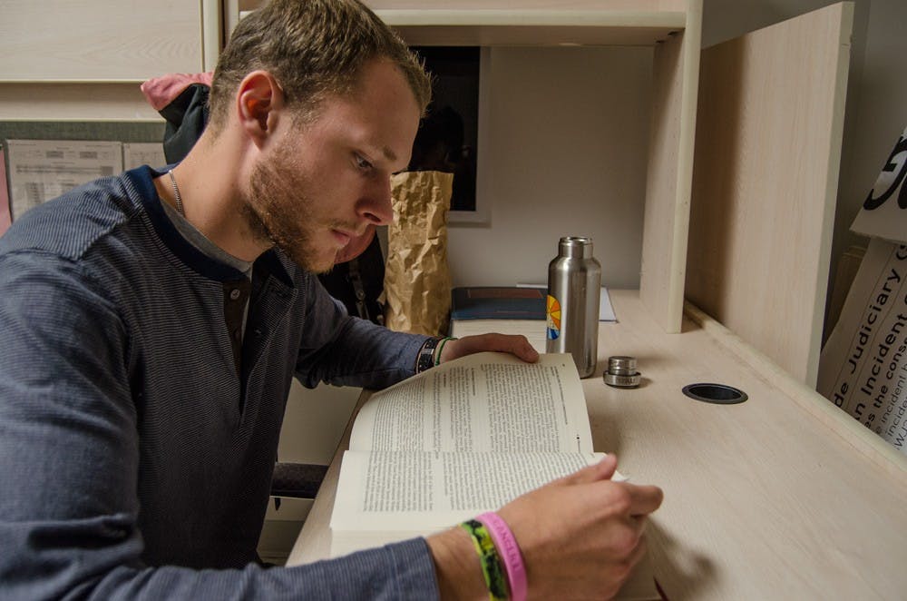 <p>Zach Persichini, a first-year student at UB’s Law School, studies in the SBU Legal office in the Student Union. SBI Legal provides advice to students who need legal advice involving anything from housing to facing the Student Wide Judiciary. </p>