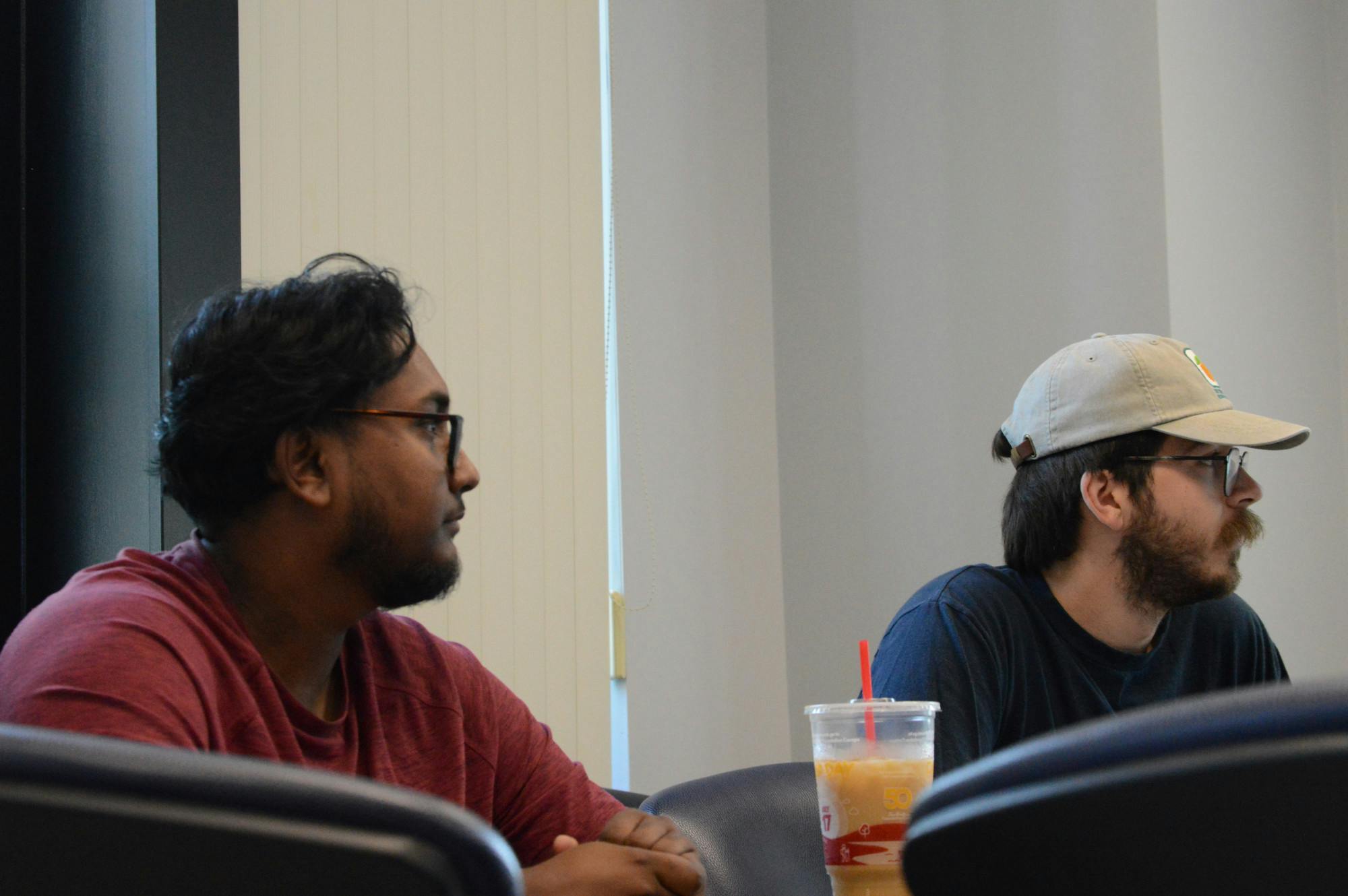Samin Bhuya (left) and Killian Hannigan (right) in a meeting with the UB ice hockey club.