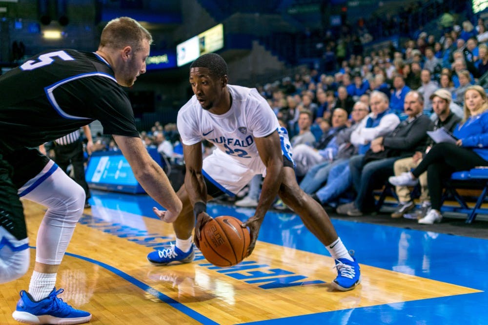 <p>Senior guard Dontay Caruthers picks up his dribble in the corner in a previous game. Caruthers had a career-high 28 points in UB’s loss against Bowling Green.</p>