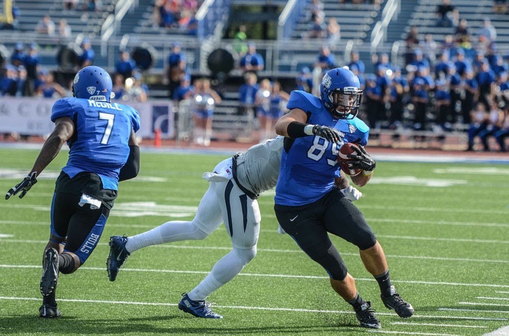 <p>Senior tight end Matt Weiser shreds off a Nevada defender from Saturday’s game. It took him four years, but Weiser finally got his chance to shine.</p>