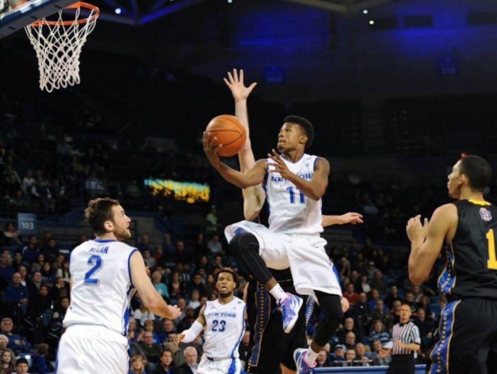 Sophomore guard Shannon Evans became the first-ever Buffalo player to record a triple-double Tuesday night as the
Bulls defeated Binghamton 76-50.&nbsp;Yusong Shi, The Spectrum.