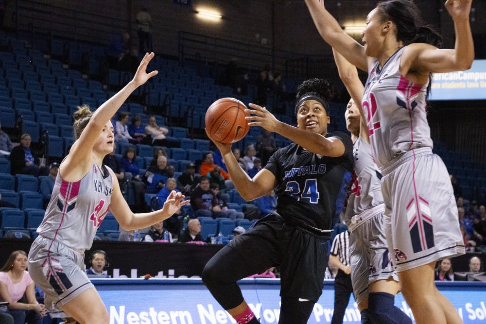 <p>Senior guard Cierra Dillard is swarmed by defenders while attempting a layup. Dillard, one of the NCAA’s leading scorers, finished with 31 points against Kent State.</p>