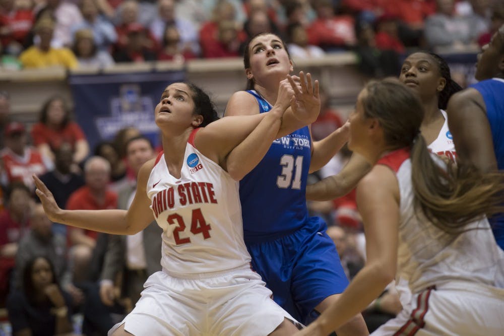 <p>Junior center Cassie Oursler tries to go for a rebound against Ohio State forward Makayla Waterman Friday. The Bulls&nbsp;fell 88-69 against Ohio State in the first round of the NCAA Women's Tournament.&nbsp;</p>