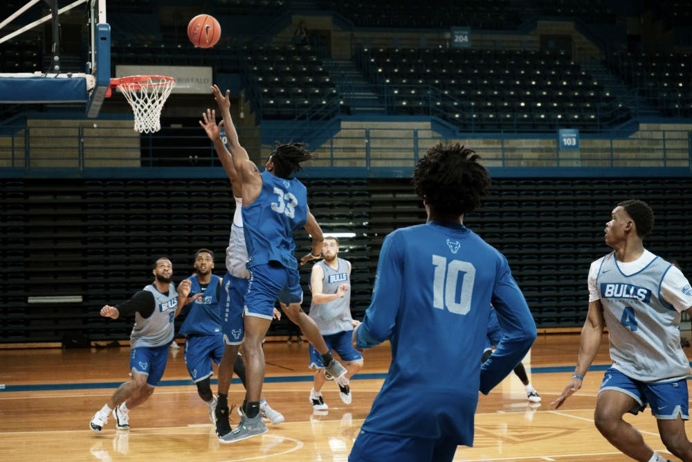 <p>Sophomore forward Jeenathan Williams goes for a layup during the men’s basketball practice on Monday.</p>