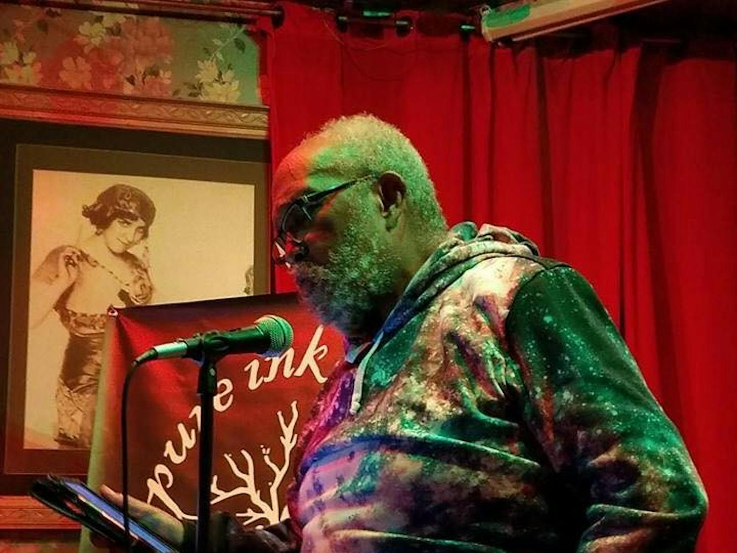 Dr. Scott Williams reads at the Pure Ink poetry slam at Buffalo’s Gypsy Parlor. Friends of Williams said his readings are  unlike anything they’ve heard before.
