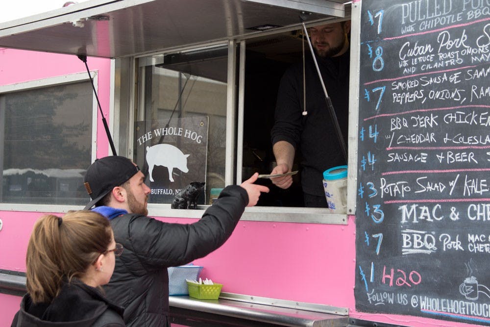 <p>Local food trucks, like The Whole Hog, and breweries congregated at LaSalle parking lot and inside of Alumni Arena to give UB students an opportunity to taste some of Buffalo’s well known&nbsp;delicacies&nbsp;at Buffalo Untapped on&nbsp;Sunday.&nbsp;</p>