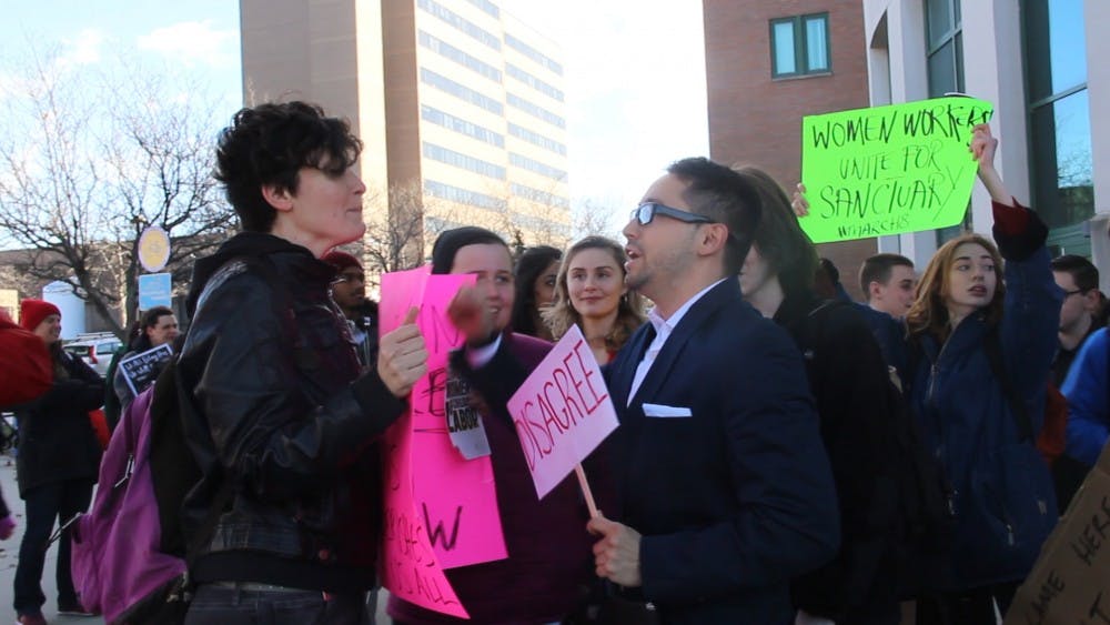 <p>UB students attending the "Unity Against Patriarchy" rally on Wednesday afternoon were met by counter protesters who held signs that said "Disagree."&nbsp;</p>