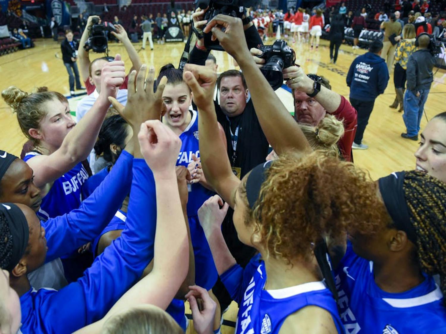 The women's basketball team huddles after its win against Ball State Wednesday night. 