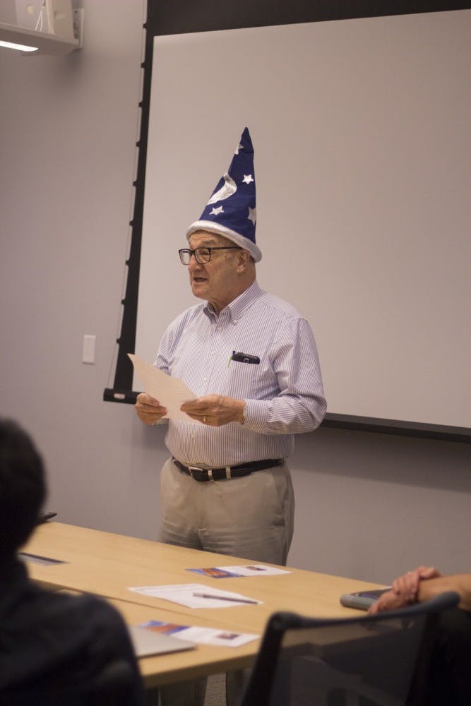 Alan Hunt, a department of computer science and engineering professor and president of Inve[n|s]t, speaks to club members at an Inve[n|s]t Thursday night meeting. &nbsp;The club began earlier this year and welcomes students, faculty and UB alums to combine business and computer science skills.