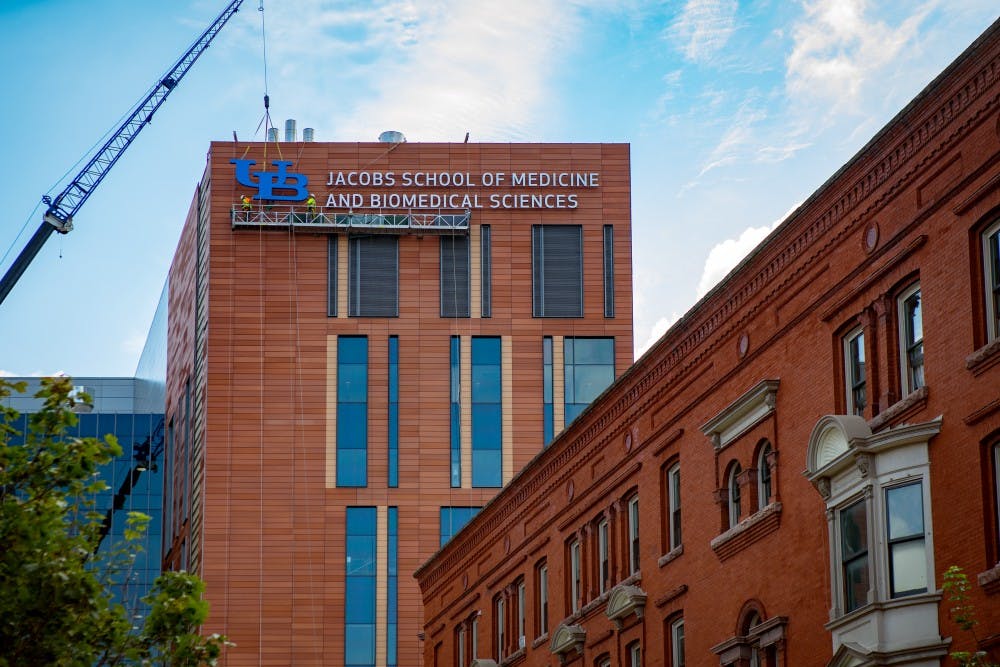 ASI Signage lifting and securing the UB logo to the top of the new Medical School Building Downtown Buffalo, NY.Photograph: Douglas Levere